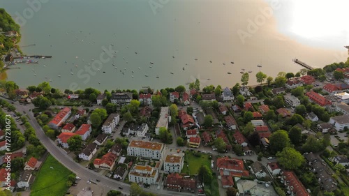 Top view of Herrsching am Ammersee showing lake, harbor, promenade, traditional houses, rural landscape, sunny summer day, water reflections, boating, sailing, scenic view, Europe, Bavarian lake