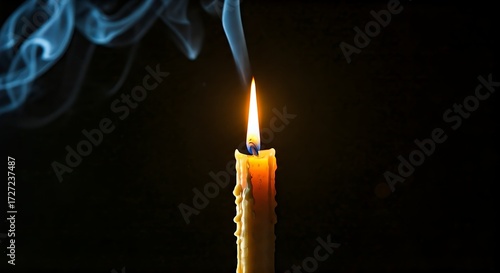 Wallpaper Mural Burning candle with wisps of smoke on black background, symbolizing hope, remembrance, or spiritual peace Torontodigital.ca