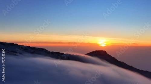 Wallpaper Mural Sunrise over mountain peaks shrouded in clouds Torontodigital.ca