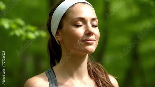 a young person breathing, inhaling, and exhaling outdoors with a garden background.
