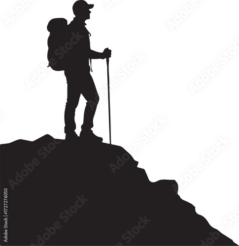 Silhouette of hiker with backpack and trekking pole on mountain peak