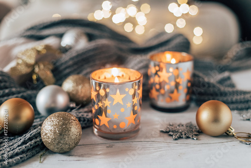 New Year and Christmas decor with garland and candles.
