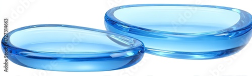 Two translucent, light blue, oval-shaped dishes, one smaller than the other, rest on a white background.  Their smooth, curved edges and glossy finish suggest a delicate and modern design