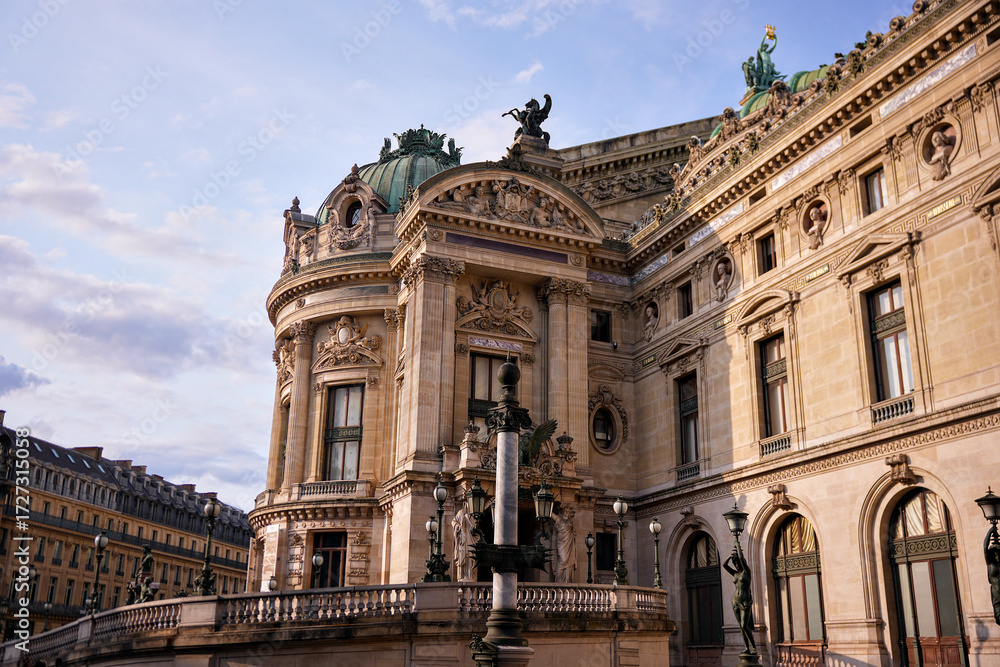 Obraz premium Beautiful facade of Palais Garnier Opera House in Paris, France. Historic landmark and cultural attraction with classical architecture, illuminated by evening sunlight.