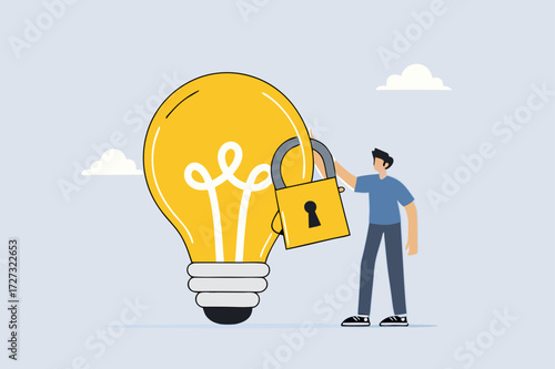 Intellectual property, entrepreneur holding glowing light bulb concept for secured padlock trademarks.