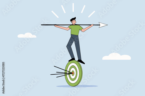 businessman balances and directs rotating archery target with arrow hit bullseye