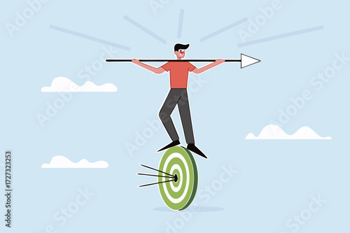 businessman balances and directs rotating archery target with arrow hit bullseye