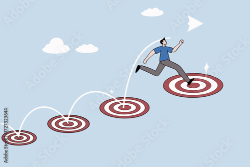 businessman jumping on bigger and higher archery bulls eye.