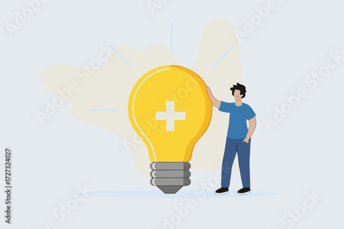 Positive thinking, businesswoman positioned with glowing light bulb concept featuring optimistic symbol.