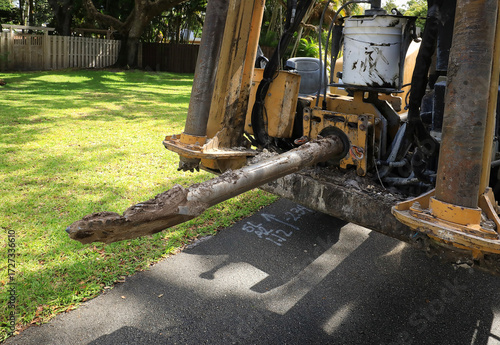 Close up of a boring rod being used to convert above ground to underground electricity, Fort Lauderdale, Florida, USA.