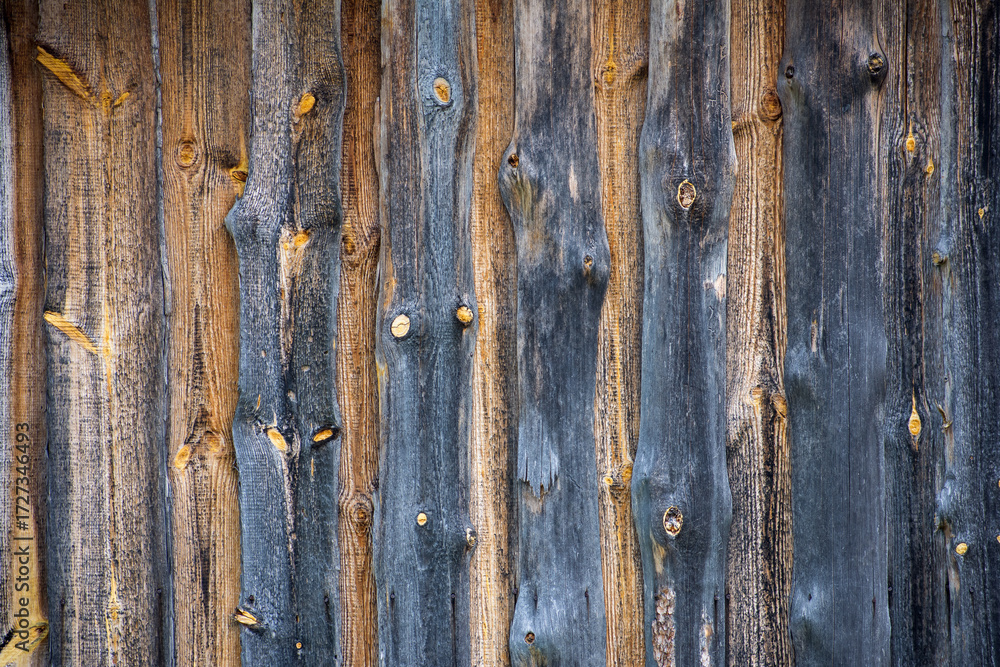 Naklejka premium Detailed view of rustic wooden boards with unique grains and textures