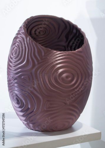 Object printed on 3D printer close up. Model printed on 3D printer from molten plastic. Form printed on 3D printer from molten plastic of brown color. 3D printing technology. Additive FDM technologies