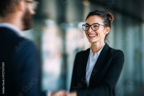 A networking reception, businesspeople engage in lively conversation, sealing new partnership with smiling. The setting is casual yet professional, encouraging open dialogue.