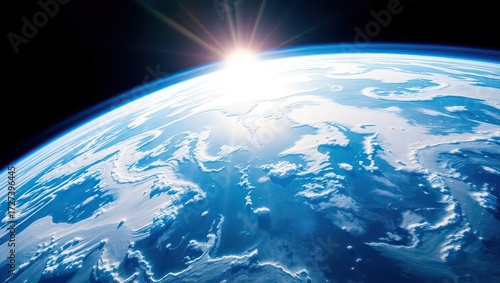 A breathtaking view of earth from space with the sun rising on the horizon