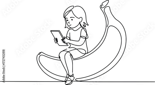 Young girl sitting on a large banana holding and reading a tablet computer