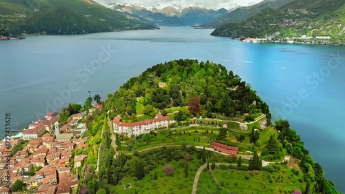 Aerial drone view of Bellagio village, Lake Como, Italy, showcasing waterfront houses, charming streets, and scenic landscapes—ideal for travel films, tourism promos, and cinematic aerials.
