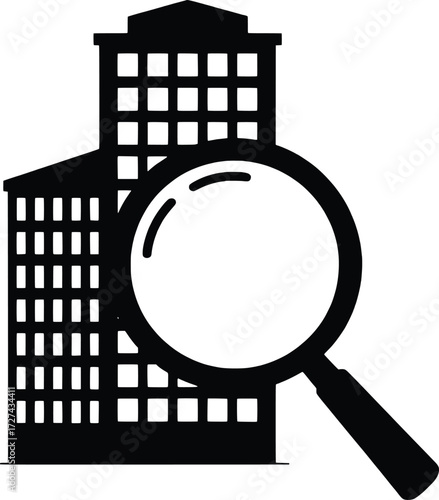 Magnifying glass examines tall office buildings symbolizing real estate search and analysis
