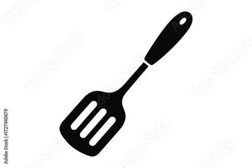 Simple black silhouette of a slotted spatula kitchen utensil