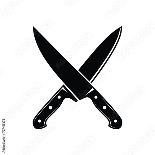Two black chef knives crossed against a white background