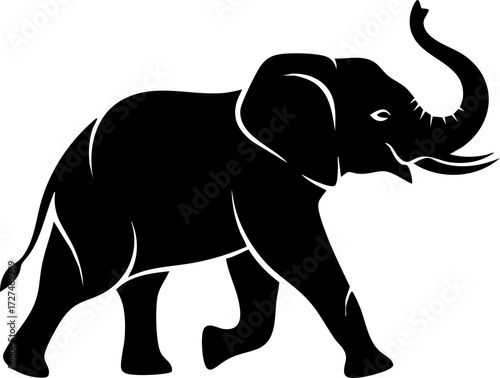 Majestic elephant striding confidently with trunk raised, symbolizing strength, wisdom, and wild beauty in a striking silhouette.