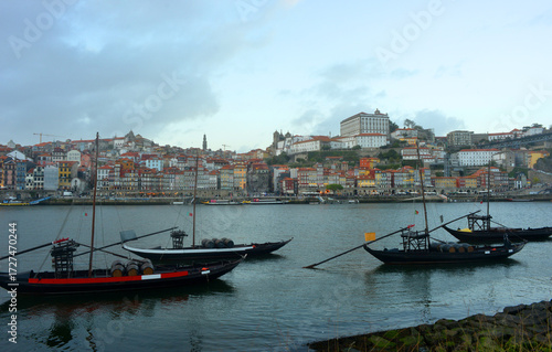 Porto, traditional boats on the river Douro with view to the old town center