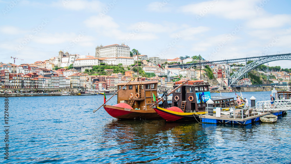 Fototapeta premium Porto, Portugal - July 10 2025: The picturesque landscape of river shore of Douro River in Portugal