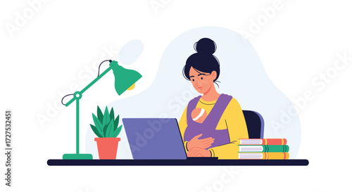 Mother working on laptop while holding her baby in a sling.