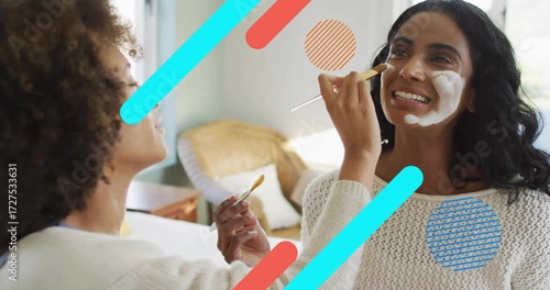 Curly-haired friend dipping brush into mask and applying cream with overlays enhancing skincare