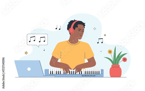 Young Man Composing Music at Home: Laptop, Keyboard, and Headphones for Music Creation and Online Collaboration in a Creative Environment