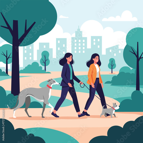 Two women walking their dogs in a park with buildings in the background.