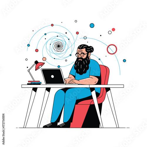 A bearded man in blue clothing sits at a desk working on a laptop.