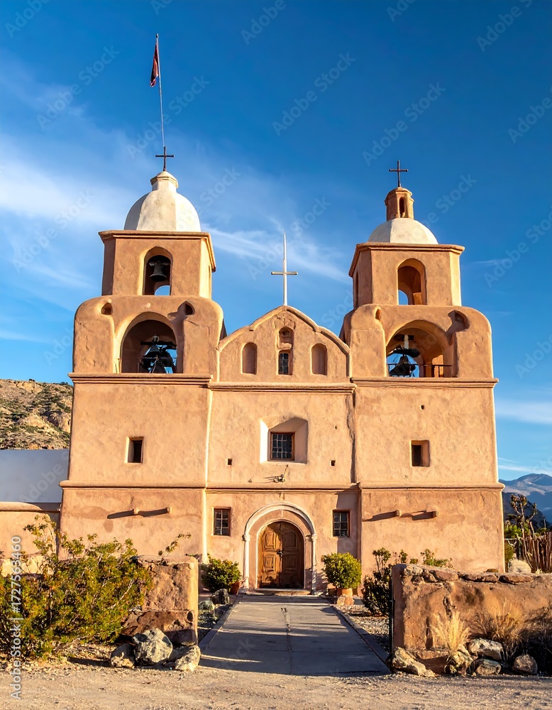 Fototapeta premium Spanish Colonial church facade, twin bell towers, arid landscape