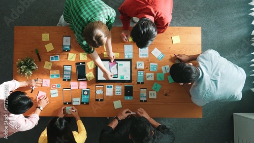Konstfotografi Top view of developer team working together to write idea about Ux ui design on colorful sticky note