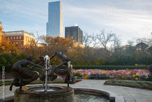 Untermyer fountain (three dancing ladies) and the lush foliage and autumn leaves trees in Central Park, New York City, United States