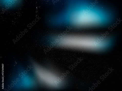 Blue glowing light soft blur with retro grain, scratches, dust and film noise on black vintage surface. Abstract textured overlay for faded retro photo effects. Defocused Blur. Screen Overlay Mode