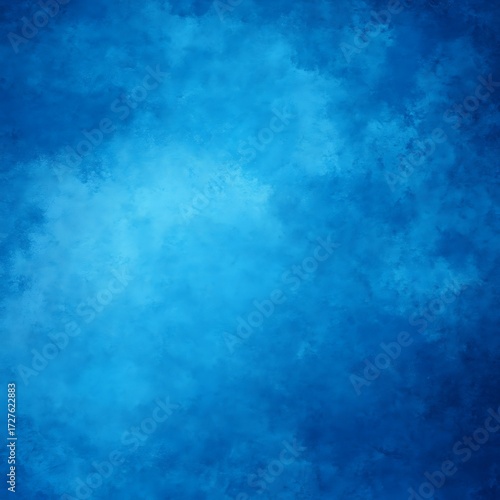 A soft, textured backdrop of deep blue, with subtle variations in shade, creating a hazy, cloudy effect