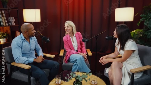 Podcast hosts engaging in lively conversation, sharing insights and anecdotes with their audience in a professional studio setting, illuminated by warm lighting and enhanced by soundproof curtains