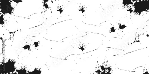 An abstract grunge ink splat texture creates a black paint splash design element for your next creative project