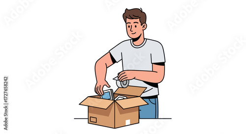 Young Man Packing Items into Cardboard Box.