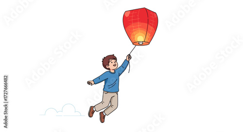 Boy releasing a red sky lantern into the air celebrating with joy.