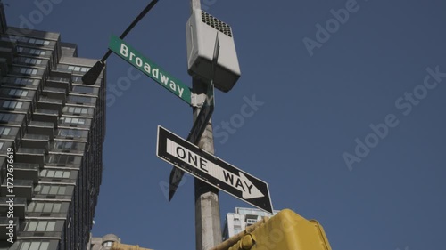 Handheld shot of a Broadway street sign