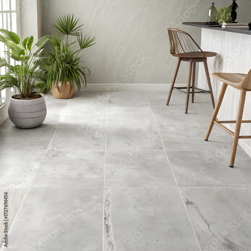 Light gray stone floor in a modern kitchen with plants and bar stools