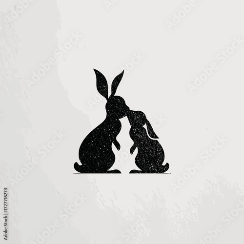 Two rabbits in silhouette, touching noses