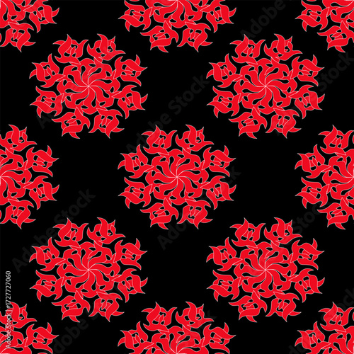 A seamless pattern with red, round, abstract flowers in a decorative pattern on a black background. Vector illustration for your designs.