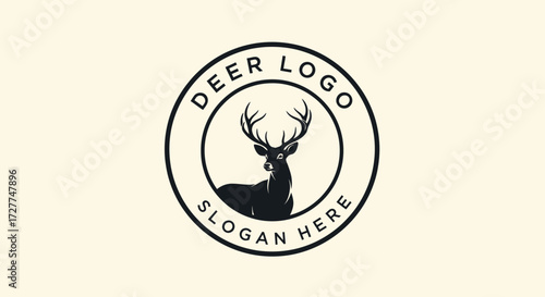 A stylized black silhouette of a majestic deer with prominent antlers is centrally featured within a circular emblem, suggesting a brand or company identity.