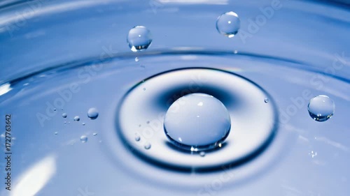 Gen-4 Turbo Water droplets falling on glass surface in macro shot 1562524004 4K (3).mp4