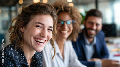 A team of professionals giggling together in a relaxed office setting, business team laughter, workplace colleagues fun, corporate bonding moment, office joy atmosphere, with copy 