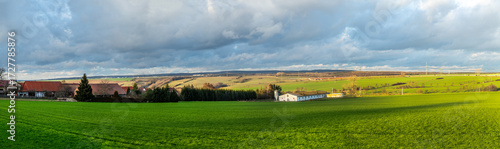 Wallpaper Mural panoramic view to agriculture landscape with farm in background  in Germany in rural landscape Torontodigital.ca