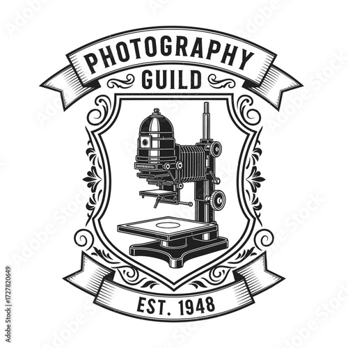 Vintage photography guild emblem featuring a detailed illustration of a darkroom enlarger machine.