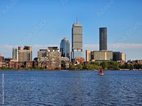 Boston skyline over Charles River with sailboat